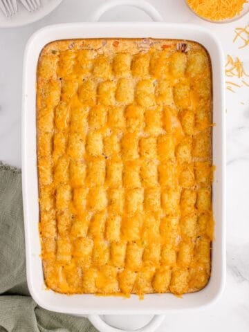 Tater tot casserole with no meat overhead in a casserole dish.