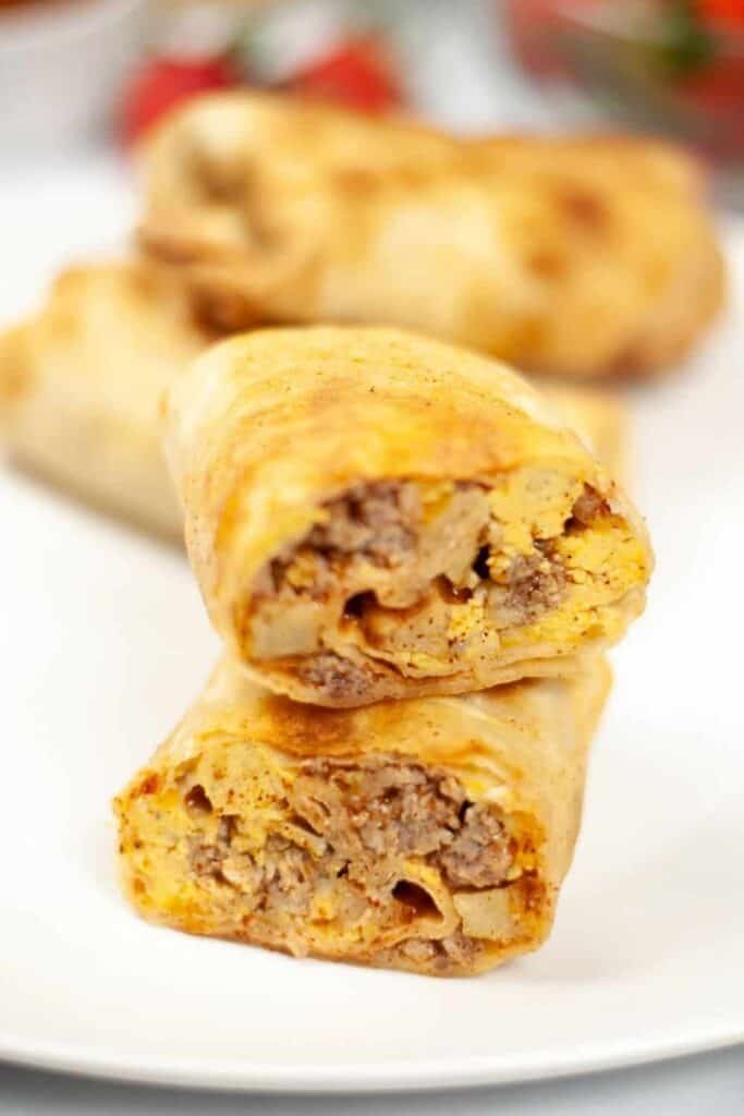 Breakfast Air Fryer Wraps cut in half stacked on top of each other