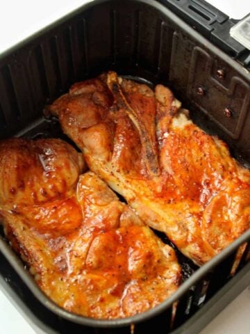 Pork Steaks in Air Fryer covered with BBQ sauce