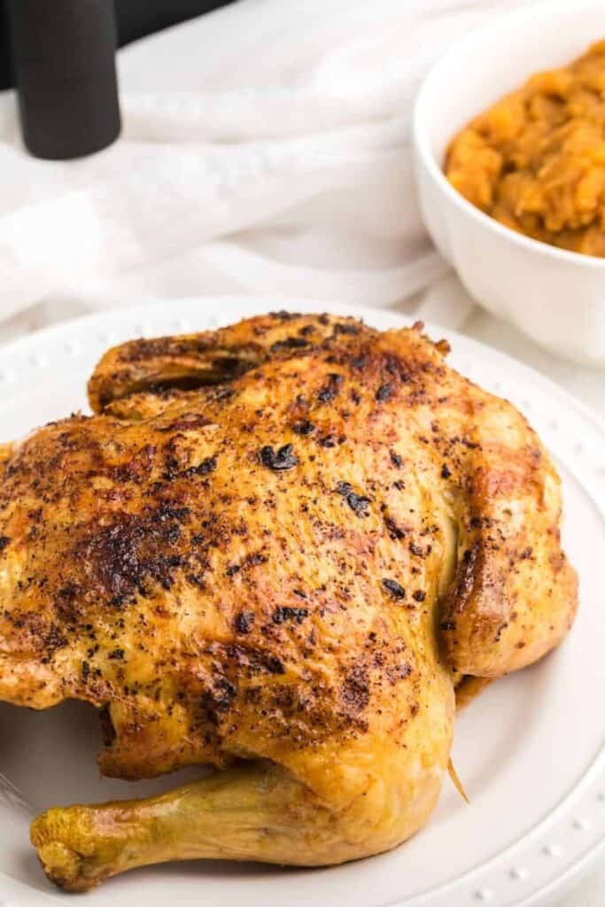 Air Fryer Whole Chicken on a white plate