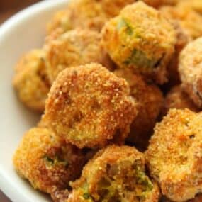 Closeup of air fried okra in a white bowl