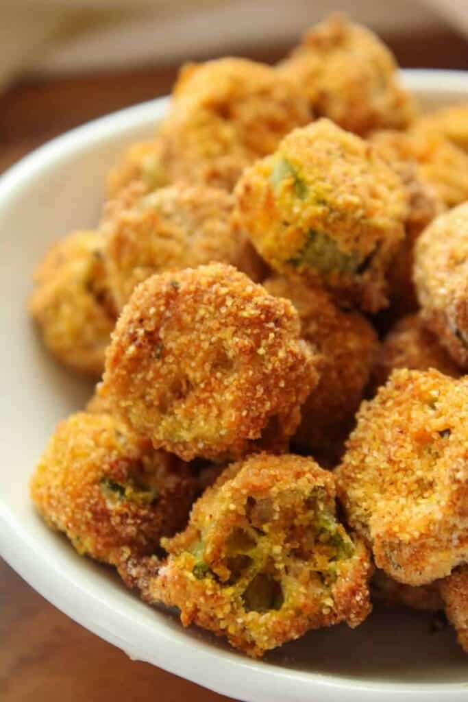 Closeup of air fried okra in a white bowl