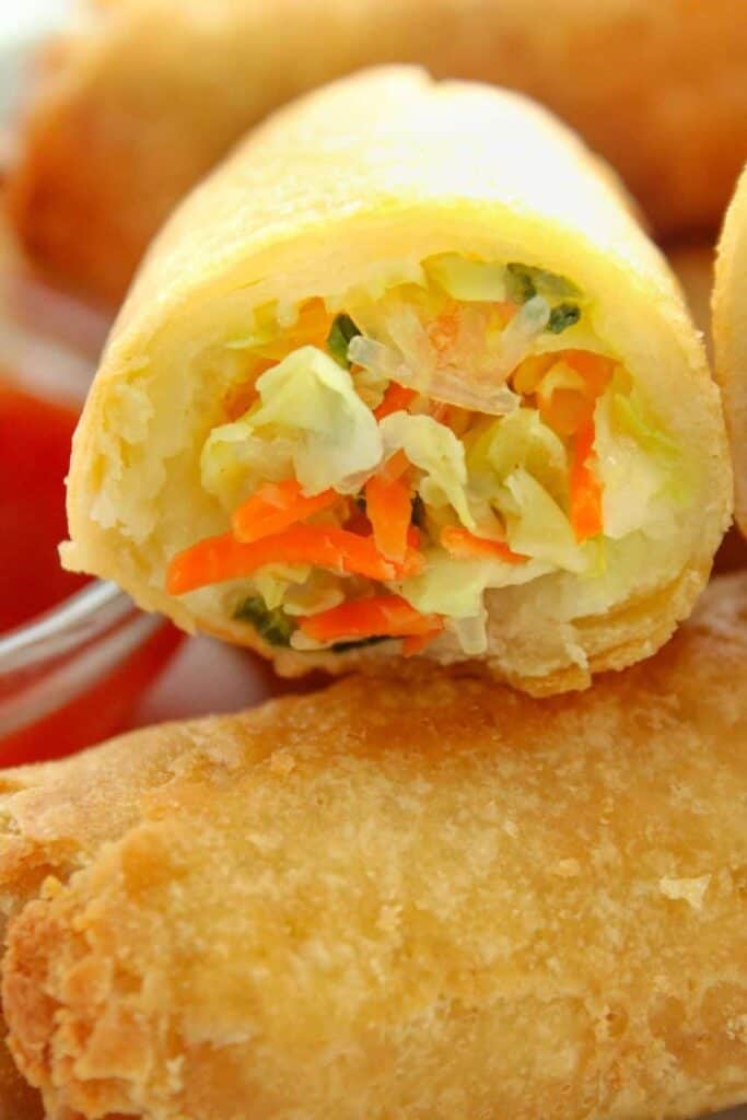 Very Closeup of frozen egg roll cut open to see the inside