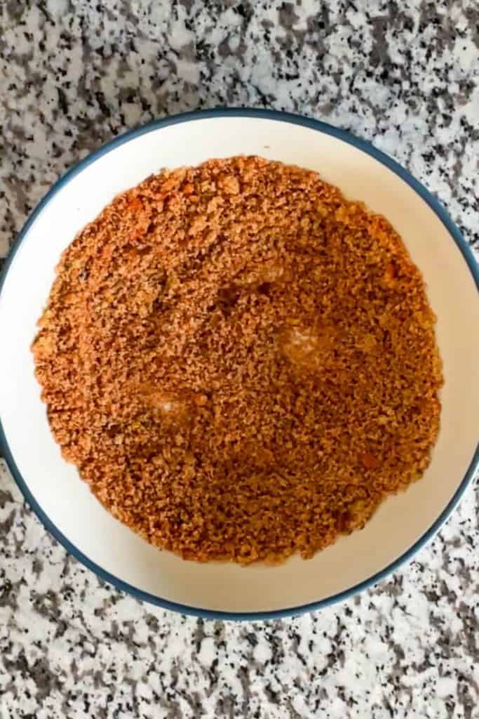 Spices mixed in a white bowl with a blue rim