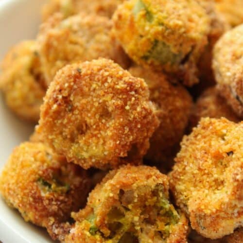 Close up of air fryer okra breaded and in a small bowl.