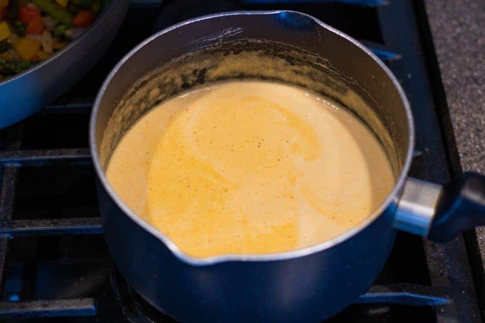 Spicy Chipotle Parmesan Cream sauce in a medium saucepan