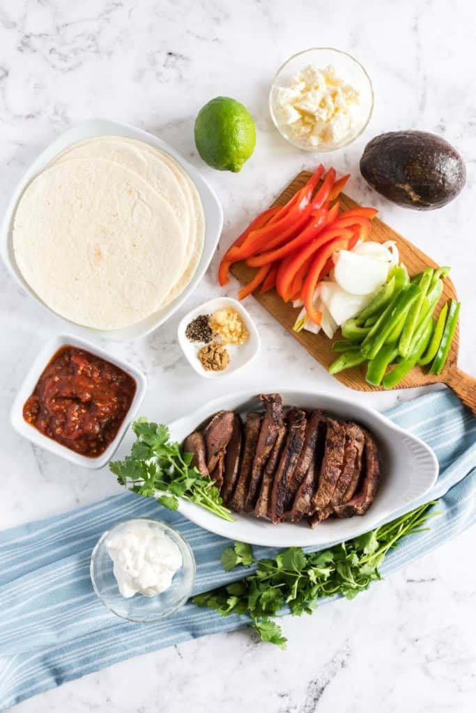 Overhead view of ingredients needed to make steak fajitas