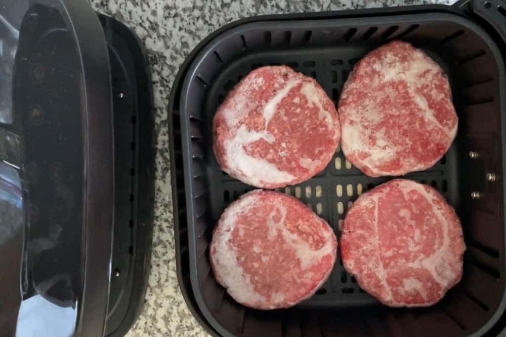 Frozen hamburgers inside air fryer