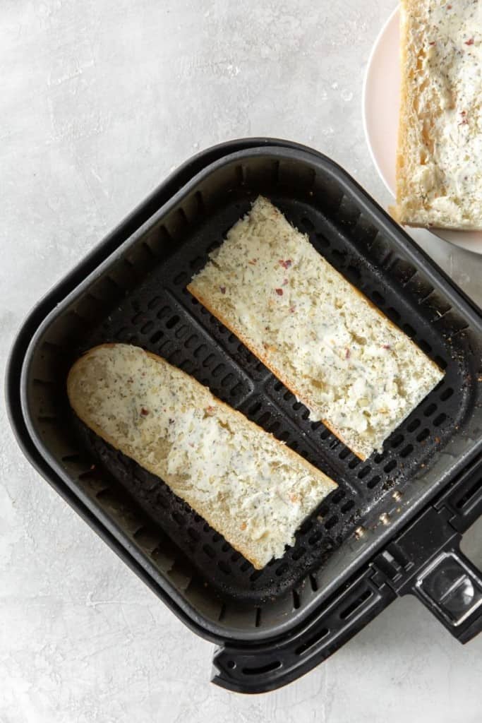 Uncooked garlic bread in air fryer