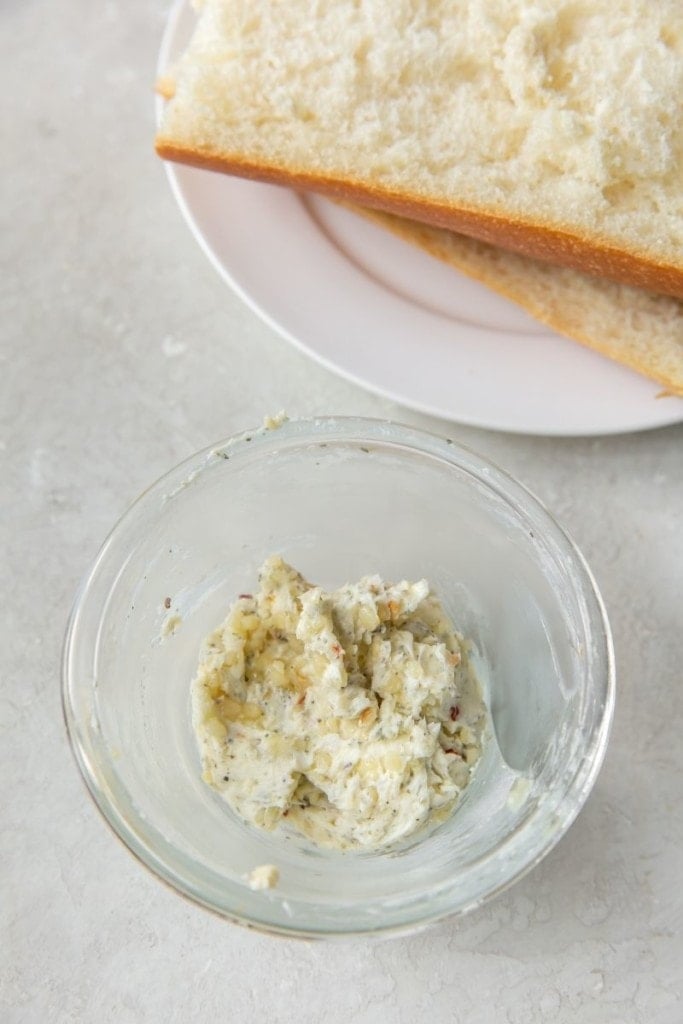 Closeup of garlic butter ingredients in a clear bowl