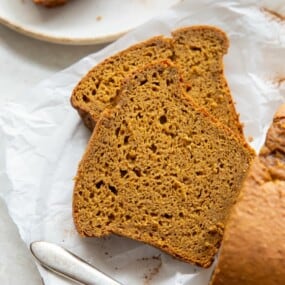 Pumpkin bread with cake mix loaf with closeup of 2 slices