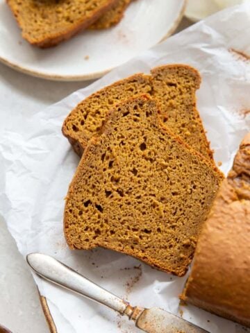 Pumpkin bread with cake mix loaf with closeup of 2 slices