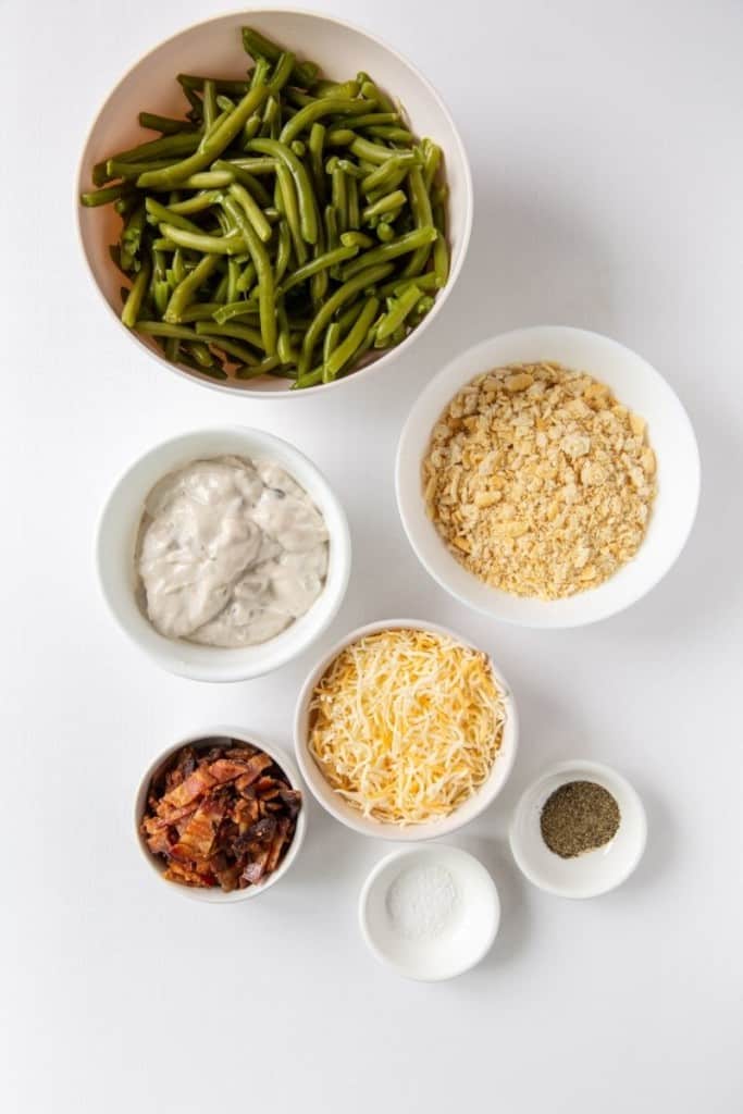 Ingredients to make Green Bean Casserole in small white bowls