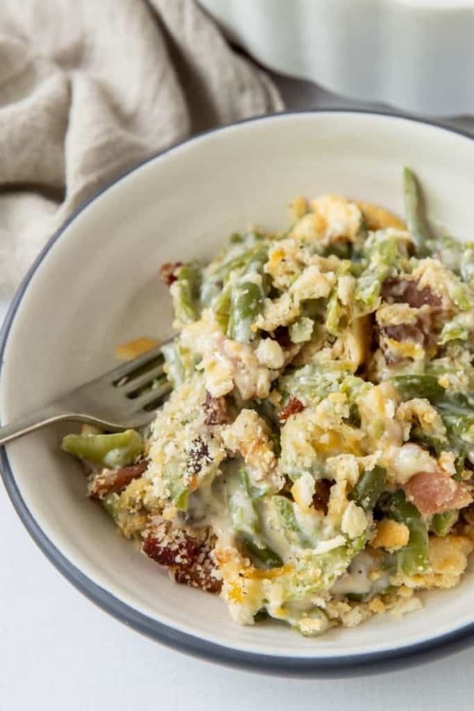 Bowl of green bean casserole with a fork inside