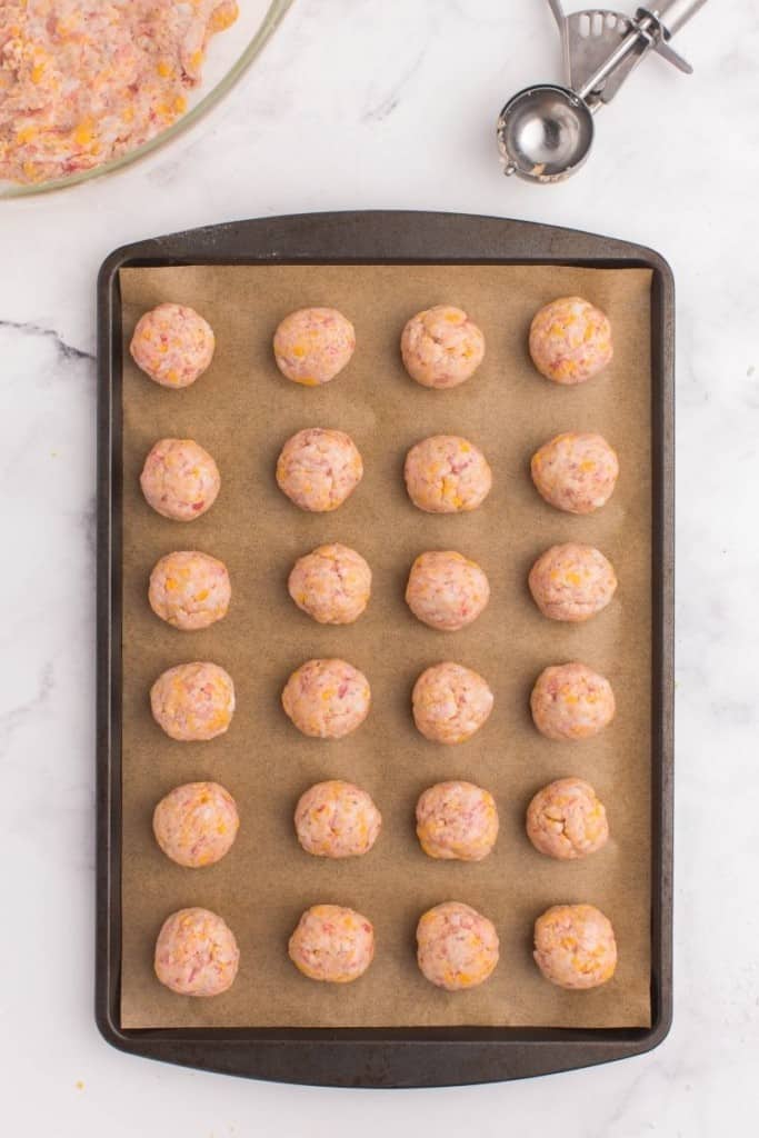 Raw sausage balls without bisquick on a baking sheet