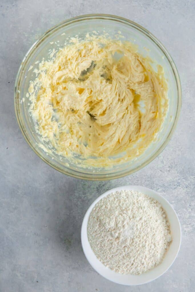 The butter, sugar, and vanilla creamed in a mixing bowl to make shortbread thumbprint cookies.