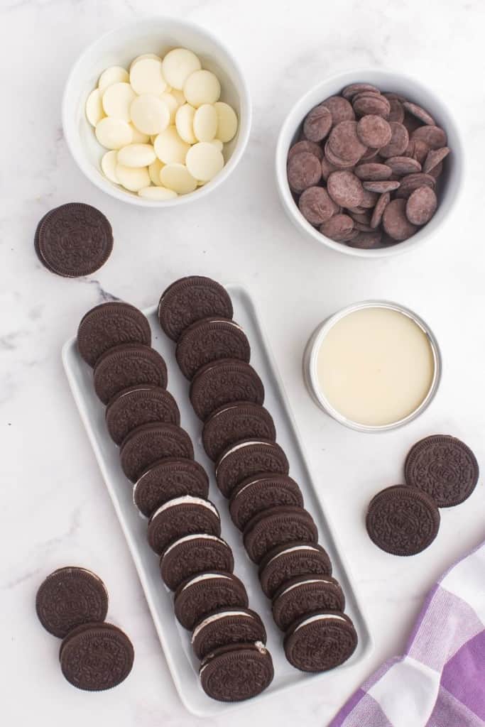 Ingredients needed to make 4 ingredient oreo balls in bowls and tray