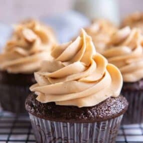 3 Ingredient Peanut Butter Frosting on top of a chocolate cupcake piped on