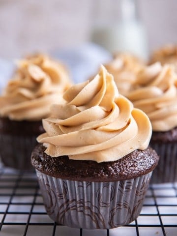 3 Ingredient Peanut Butter Frosting on top of a chocolate cupcake piped on