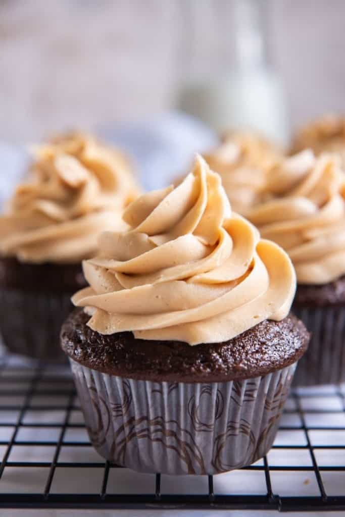 3 Ingredient Peanut Butter Frosting on top of a chocolate cupcake piped on