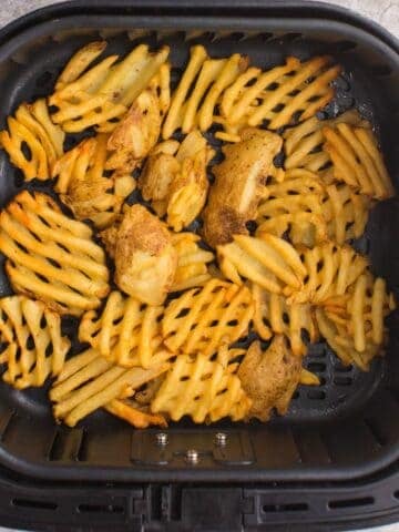 Close up of Waffle Fries in the Air Fryer basket