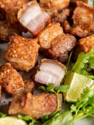 Close up of air fryer pork belly that is golden brown to show the crispiness.