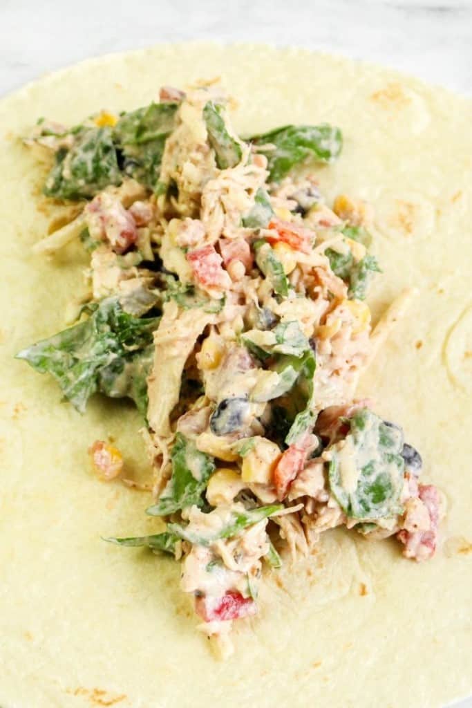 Chicken wrap mixture on top of a flour tortilla