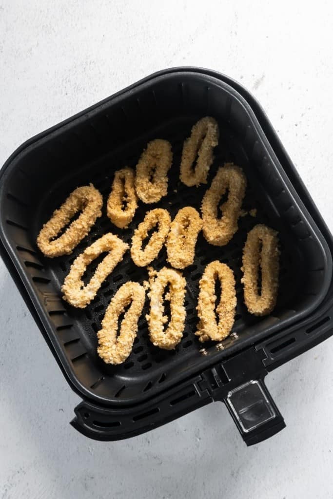 Breaded calamari in air fryer basket