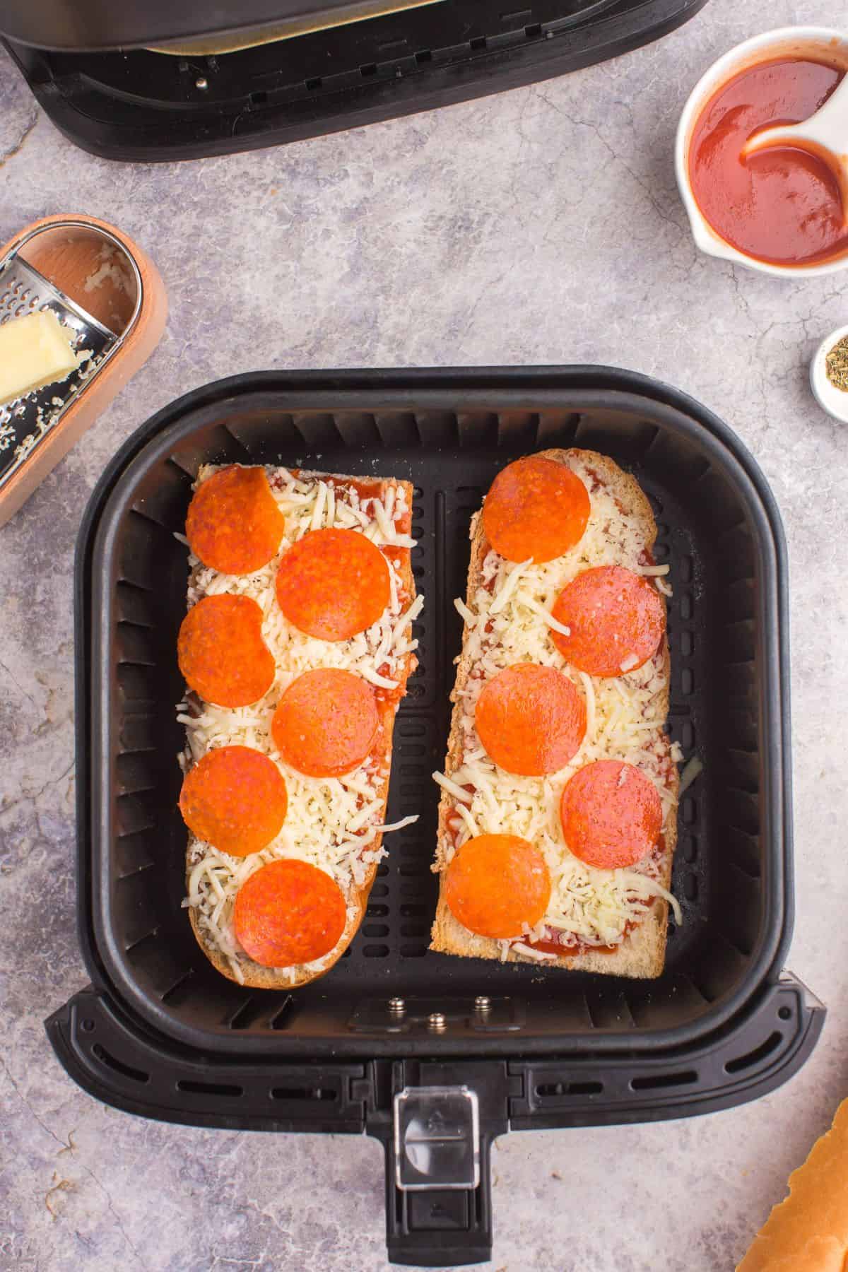 Ready to air fry french bread pizza in the basket.