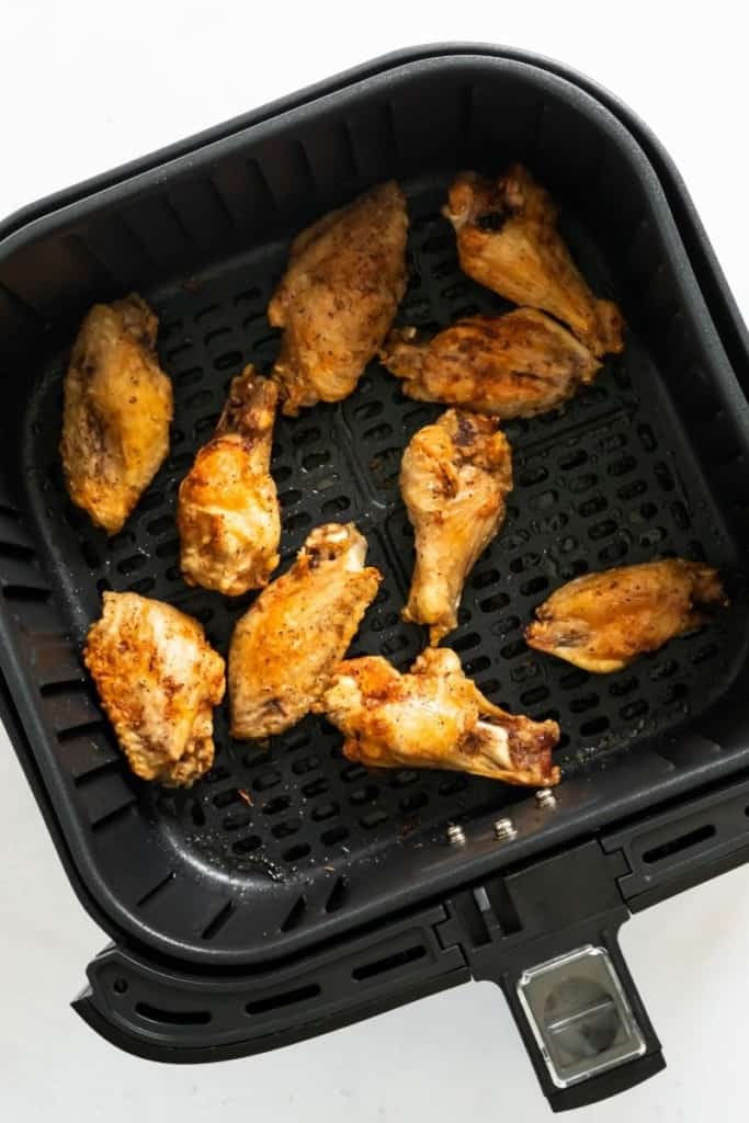 Cooked frozen wings in air fryer basket