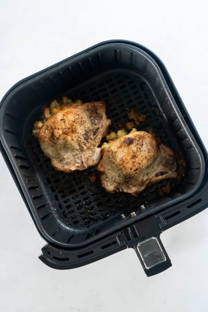 Cooked stuffed pork chops in air fryer basket