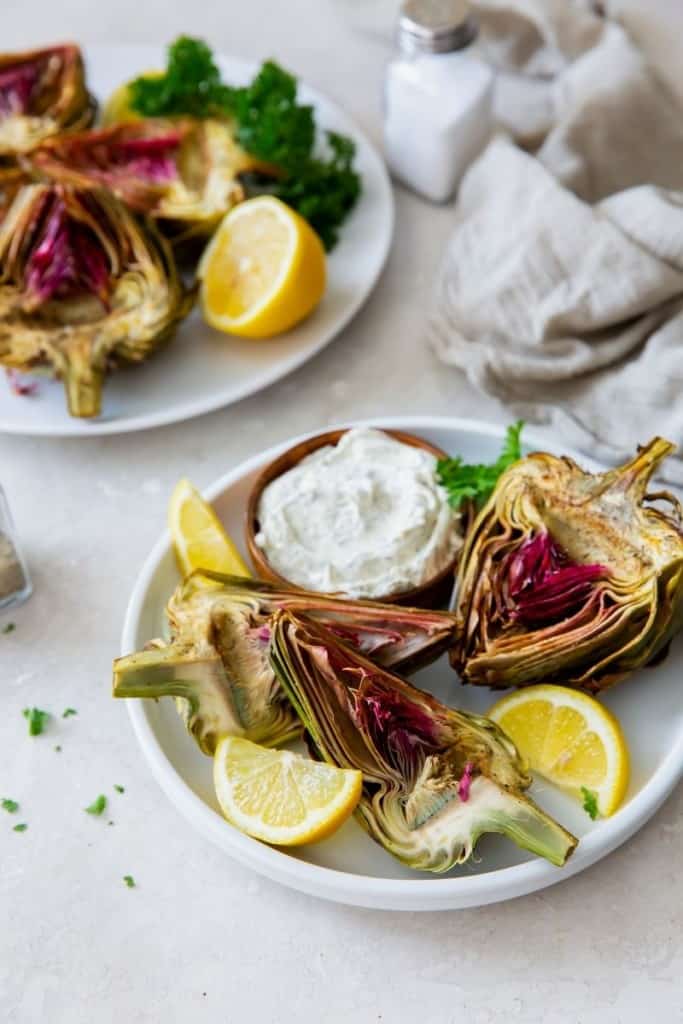 air fryer artichokes with dipping sauce and lemons