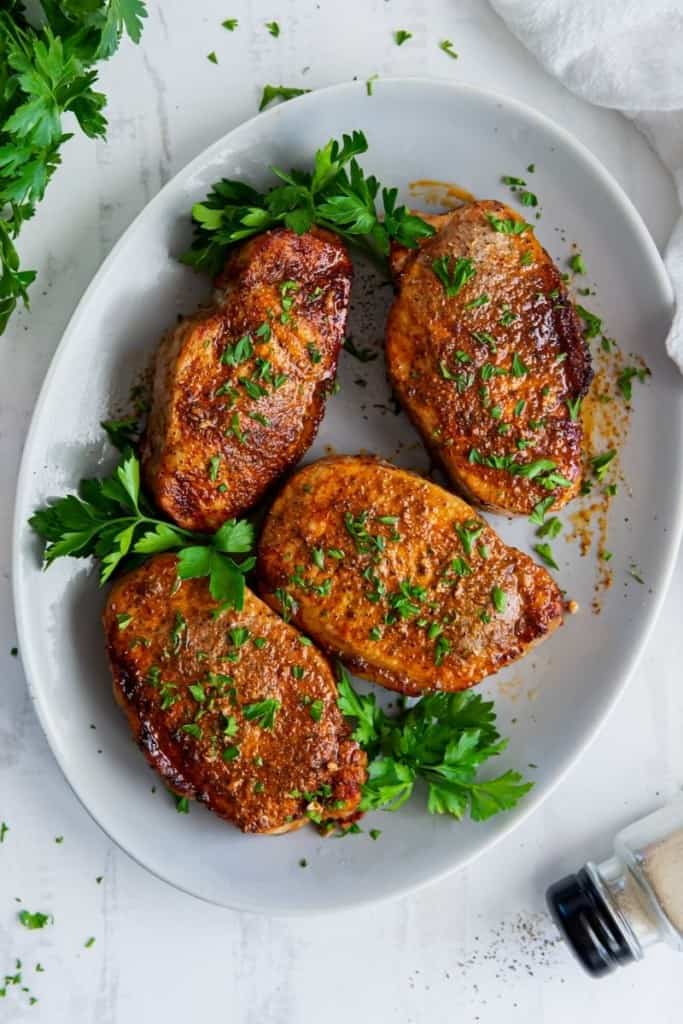 pork chops on plate with garnish