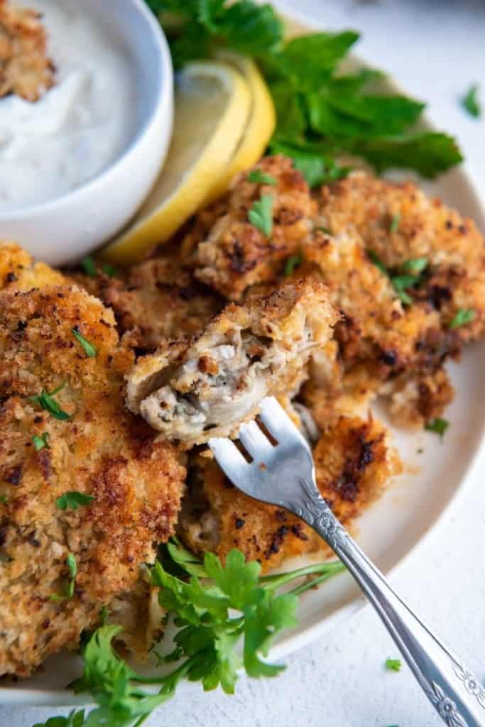 Crispy air fryer oysters on serving plate with fork