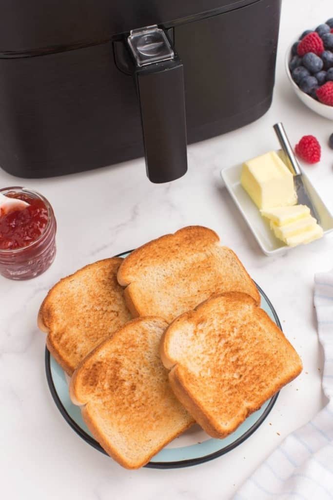 slices of air fryer toast with butter on plate