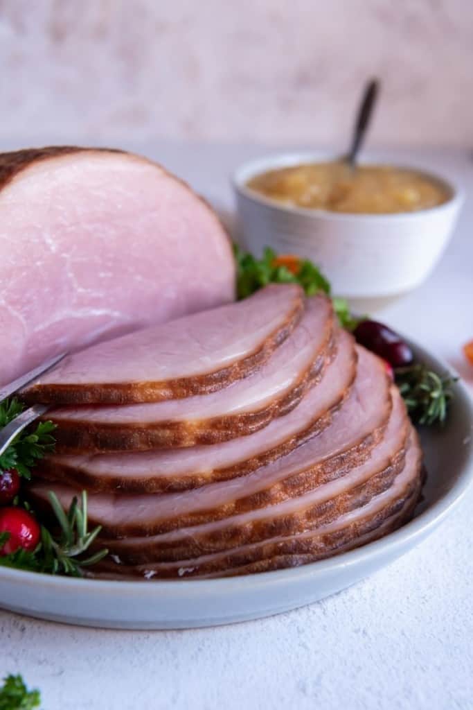 slices of cooked ham on plate