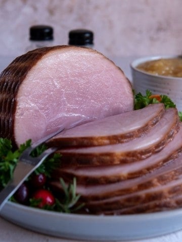 Sliced frozen ham on plate