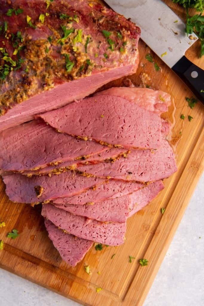 slices of air fryer corned beef on cutting board
