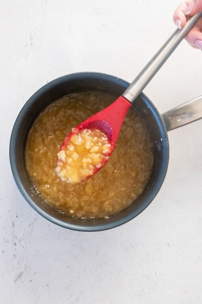 mix together ingredients in saucepan for pineapple sauce for ham