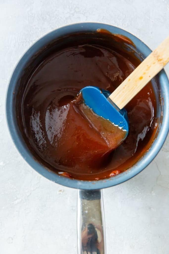 cook ingredients while stirring frequently to make BBQ sauce