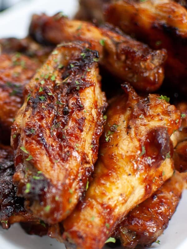 Close up of the air fryer chicken wings with BBQ sauce on them.
