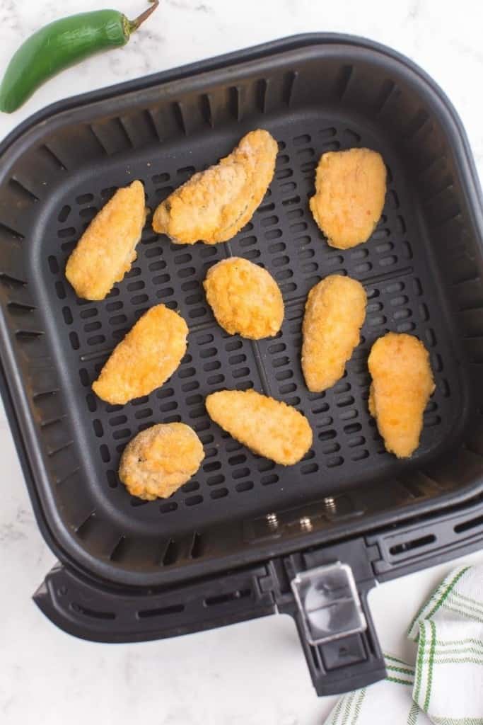 place frozen poppers in single layer in the air fryer