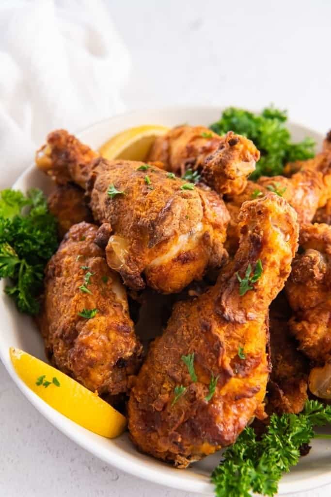 air fried chicken tenders on plate with garnishes