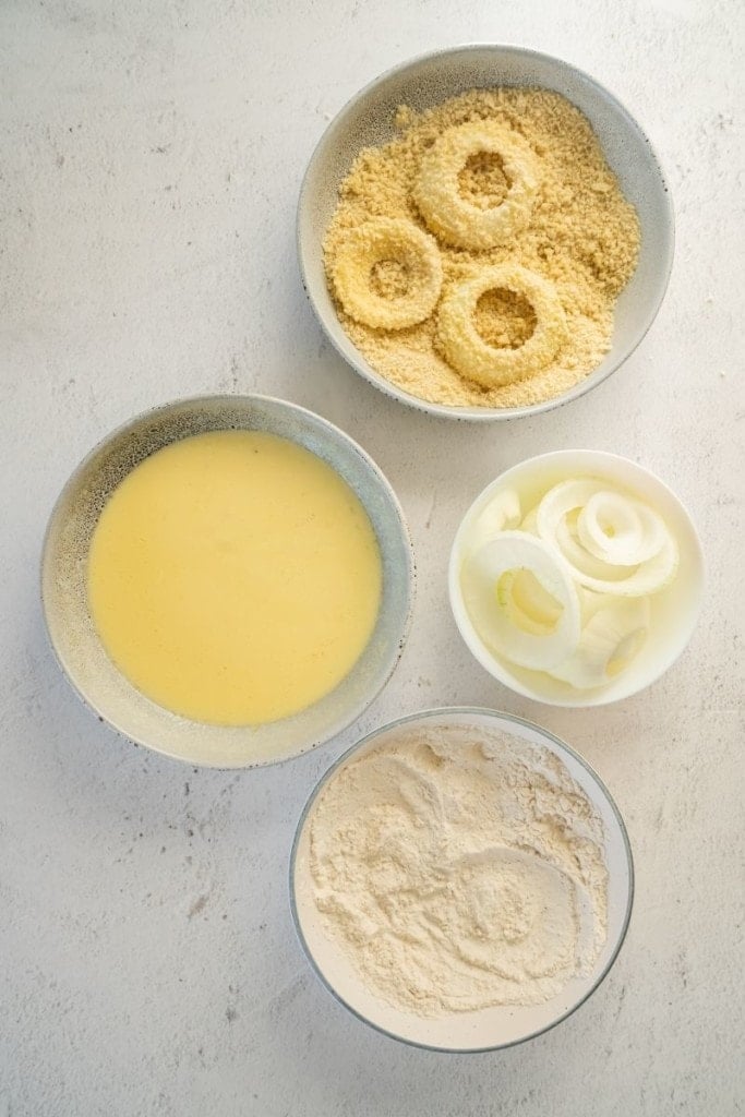 dip onion rings into panko bread crumbs