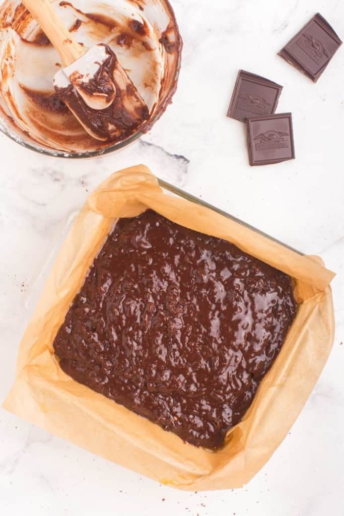 pour brownie batter into pan