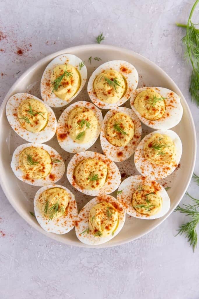 round plate full of deviled eggs without vinegar