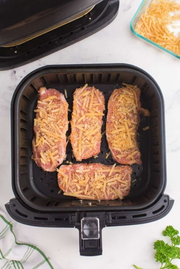 place boneless pork chops in air fryer in a single layer