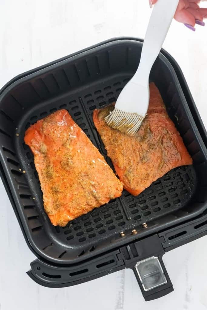 place seasoned frozen salmon fillets in air fryer