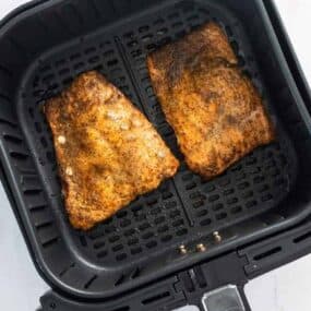 flip salmon fillets to cook evenly in air fryer
