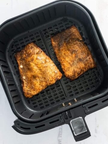 flip salmon fillets to cook evenly in air fryer